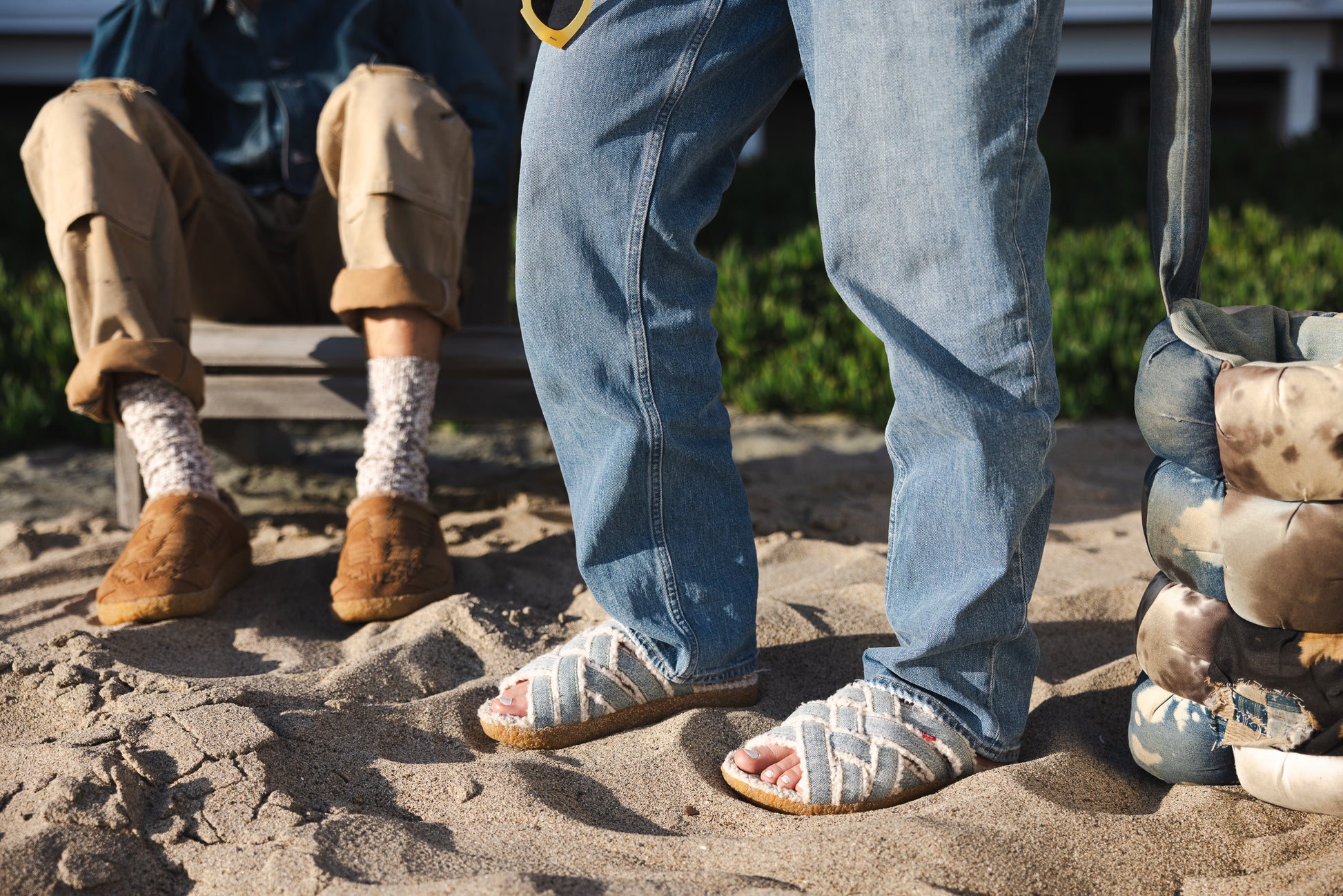 Lifestyle photo of person wearing Malibu sandals all new zuma Lx Sherpa in grey and crepe sole for fall winter